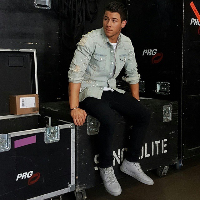Nick-Jonas-wearing-Off-White-Distressed-denim-shirt-and-Balenciaga-monochrome-grey-sneakers-shoes-640x640